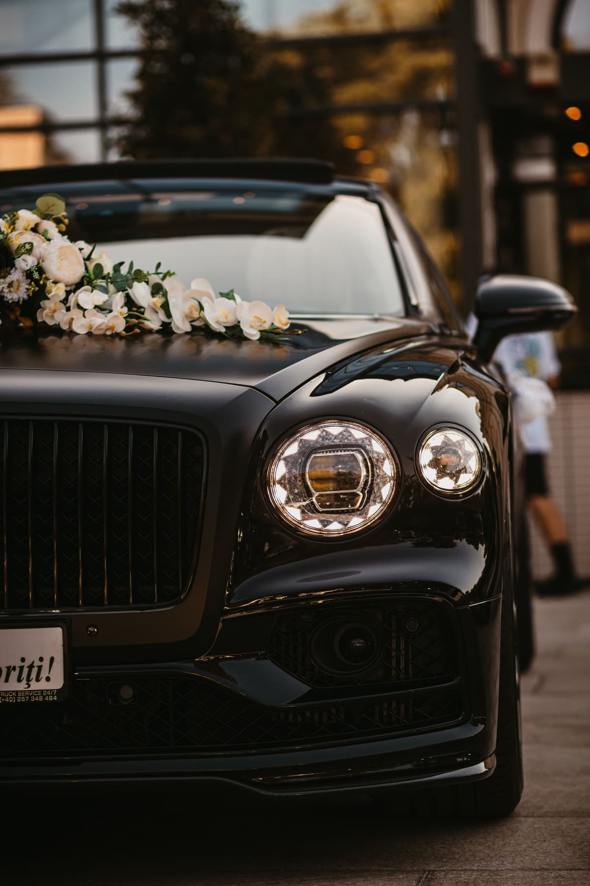 Front detail of a luxury executive vehicle prepared for passenger collection