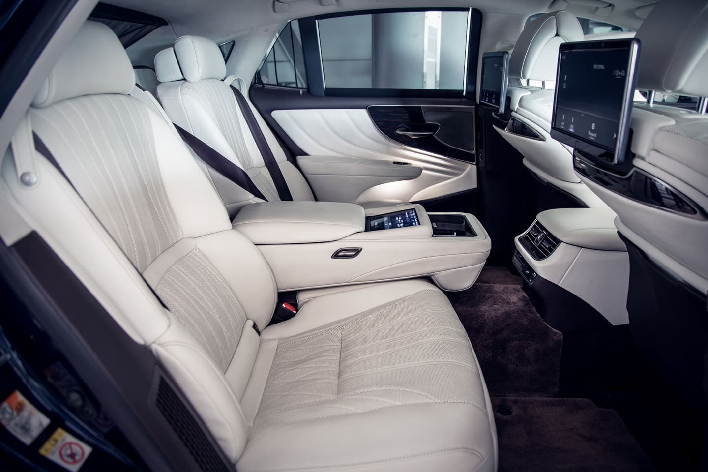 Premium rear-seat chauffeur interior prepared for a charter passenger